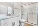 Modern bathroom with a glass enclosed shower, a wood floor, and a white vanity at 16207 Point Rock Dr, Winter Garden, FL 34787