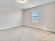 Bedroom with neutral carpeting, natural light, and a serene atmosphere at 16207 Point Rock Dr, Winter Garden, FL 34787