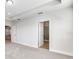 A bedroom leads to the bathroom, which features a modern glass-enclosed shower and tile flooring at 16207 Point Rock Dr, Winter Garden, FL 34787