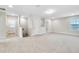 Spacious bonus room featuring neutral carpeting, great natural light, and neutral paint at 16207 Point Rock Dr, Winter Garden, FL 34787