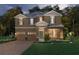 Charming two-story home with a manicured lawn, three-car garage and colorful turquoise front door at 16207 Point Rock Dr, Winter Garden, FL 34787