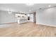 Spacious open concept living room with tile floor, recessed lighting and kitchen with large island at 16207 Point Rock Dr, Winter Garden, FL 34787