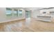 Bright and open living room with sliding door and tiled floor adjacent to a kitchen, perfect for entertaining at 16207 Point Rock Dr, Winter Garden, FL 34787