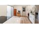 Modern kitchen featuring stainless steel appliances, stone countertops, and sleek white cabinetry at 169 Fallwood St, Fern Park, FL 32730