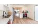 Bright kitchen featuring stainless steel appliances, white cabinetry, and access to the lanai at 169 Fallwood St, Fern Park, FL 32730