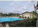 Community pool featuring blue skies and lots of space to relax at 169 Fallwood St, Fern Park, FL 32730