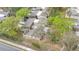 An aerial view of a cozy residential community surrounded by lush trees and well-maintained landscaping at 169 Fallwood St, Fern Park, FL 32730