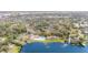 An aerial view showing community amenities including a pool, lake access, tennis courts and community building at 169 Fallwood St, Fern Park, FL 32730