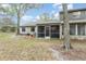 Spacious backyard featuring a screened-in porch for outdoor relaxation and leisure at 169 Fallwood St, Fern Park, FL 32730