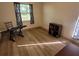 Versatile bedroom space with wood floors and a large window for natural light at 169 Fallwood St, Fern Park, FL 32730