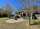 Backyard with a fire pit and covered patio at 171 Church St, Geneva, FL 32732