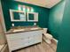 Bathroom featuring a double granite vanity, new tile flooring, and shower and toilet at 171 Church St, Geneva, FL 32732