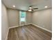 Bedroom with new paint, baseboards, luxury vinyl flooring, and ceiling fan at 171 Church St, Geneva, FL 32732