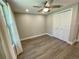 Bedroom featuring new paint, baseboards, luxury vinyl flooring, ceiling fan, and closet at 171 Church St, Geneva, FL 32732