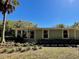 Charming single-story home showcasing its well-manicured front yard and appealing curb appeal at 171 Church St, Geneva, FL 32732