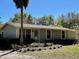 Charming single-story home showcasing its well-manicured front yard and appealing curb appeal at 171 Church St, Geneva, FL 32732
