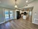 Bright kitchen boasts white cabinets, an island, and stainless steel appliances at 171 Church St, Geneva, FL 32732