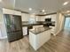 Updated kitchen with island, granite countertops and stainless steel appliances at 171 Church St, Geneva, FL 32732