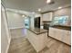 Kitchen features granite counters, stainless appliances, and white cabinetry at 171 Church St, Geneva, FL 32732