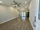Open-concept living room features vaulted ceilings, wood-look floors, and lots of natural light at 171 Church St, Geneva, FL 32732