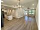 Open-concept living room showcases a seamless flow to the kitchen and inviting decor at 171 Church St, Geneva, FL 32732