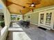 Covered patio with wood ceiling, ceiling fans, and outdoor dining set at 171 Church St, Geneva, FL 32732