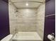 Modern bathroom shower featuring tile surround, upgraded fixtures, and an updated shower head at 171 Church St, Geneva, FL 32732