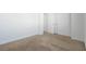 Carpeted bedroom with closet and door at 17442 Hidden Forest Dr, Clermont, FL 34714
