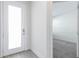 Bright entryway and open room featuring clean lines, light flooring, and a modern aesthetic at 17442 Hidden Forest Dr, Clermont, FL 34714