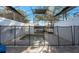 Enclosed pool area with a safety fence, paved patio, and a screened enclosure, offering privacy at 17442 Hidden Forest Dr, Clermont, FL 34714