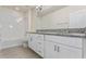A bathroom showcasing a double sink, granite countertop vanity, and shower with tub at 18046 Cider Mill Ln, Winter Garden, FL 34787