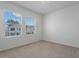 Bedroom with carpeted floors featuring a window with blinds and neutral-painted walls at 18046 Cider Mill Ln, Winter Garden, FL 34787