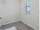 The utility room features tile floors, a window with blinds, and white-painted walls at 18046 Cider Mill Ln, Winter Garden, FL 34787