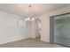 Bright dining area with stylish chandelier and sliding glass doors to patio at 18046 Cider Mill Ln, Winter Garden, FL 34787