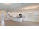 Spacious open concept kitchen with granite counters, stainless appliances, and an island at 18046 Cider Mill Ln, Winter Garden, FL 34787