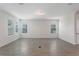 Spacious living room with large windows and neutral tile flooring at 18046 Cider Mill Ln, Winter Garden, FL 34787