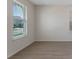 Bright living room featuring tile flooring and large windows that provide lots of natural light at 18046 Cider Mill Ln, Winter Garden, FL 34787