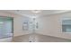 Bright living room with large windows and sliding glass door to outdoor space at 18046 Cider Mill Ln, Winter Garden, FL 34787