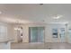 Open concept living room and kitchen with stainless steel appliances and dining area at 18046 Cider Mill Ln, Winter Garden, FL 34787