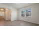 Open-concept living room with two windows that let in plenty of natural light at 18046 Cider Mill Ln, Winter Garden, FL 34787