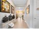 Inviting hallway with decorative wall art, lighting, and elegant decor accents at 18405 Mowry Ct, Orlando, FL 32827