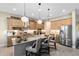 Modern kitchen featuring stainless steel appliances, granite countertops, and a spacious island with bar seating at 18405 Mowry Ct, Orlando, FL 32827