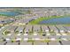 Aerial view of a residential community featuring well-maintained homes and scenic ponds at 1972 Spring Shower Cir, Kissimmee, FL 34744