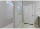 Modern bathroom showcasing sleek gray tiles, a glass shower partition, and a bright, contemporary design at 1972 Spring Shower Cir, Kissimmee, FL 34744
