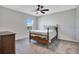 Bedroom featuring a window with a lakeside view, a full size bed, gray carpeting, and neutral wall colors at 1972 Spring Shower Cir, Kissimmee, FL 34744