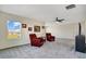 Bonus room featuring two sitting chairs, television, recessed lighting, and great natural light from windows with neighborhood views at 1972 Spring Shower Cir, Kissimmee, FL 34744