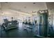 Well-equipped community gym featuring modern cardio machines, weight training equipment, and ample natural light at 1972 Spring Shower Cir, Kissimmee, FL 34744