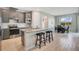 Modern kitchen with stainless steel appliances, light grey cabinetry, and a central island at 1972 Spring Shower Cir, Kissimmee, FL 34744