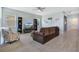 Spacious living room with ceiling fan, lots of natural light, and modern furnishings at 1972 Spring Shower Cir, Kissimmee, FL 34744