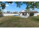 This home features a refreshing pool with a nice backyard and white fencing for added privacy at 2531 Ludlow St, Deltona, FL 32738